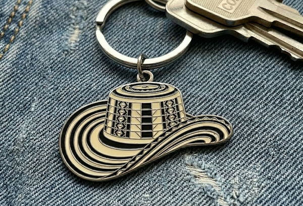 Custom enamel keychain - cowboy hat design in black and silver on keyring with denim background